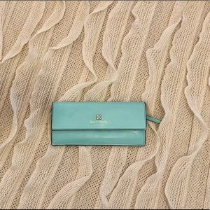 Light teal Kate Spade flap wallet.